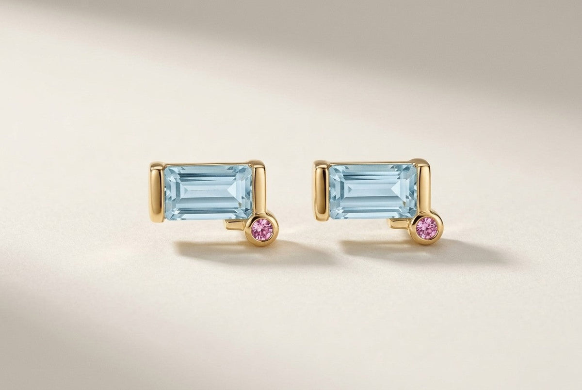 D by DONYDO Tessere Stud Earrings with pink sapphire step – matched emerald-cut aquamarines in half bezels with 2 mm pink sapphires, yellow gold | DONYDO Jewelry