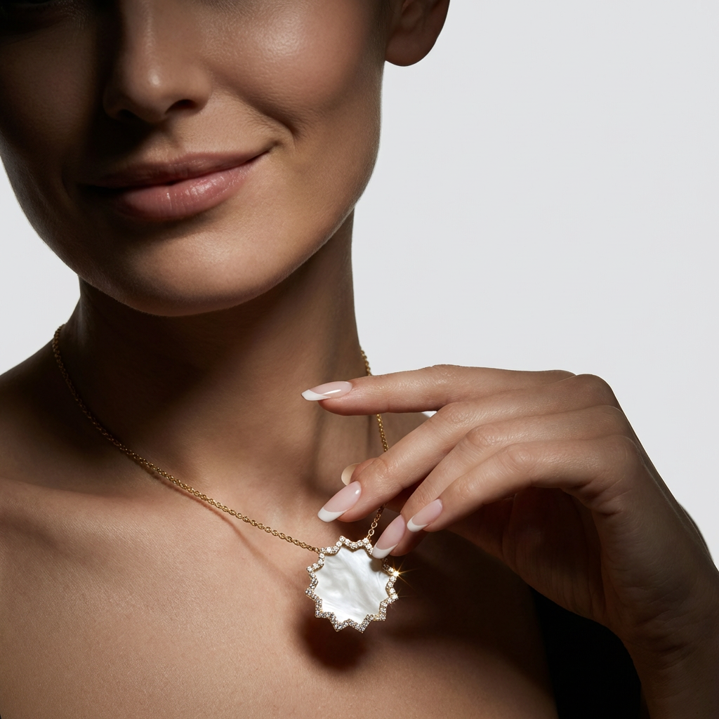 Model wearing the ORA 30 pendant necklace in 14K gold with natural white mother-of-pearl disc | DONYDO Jewelry
